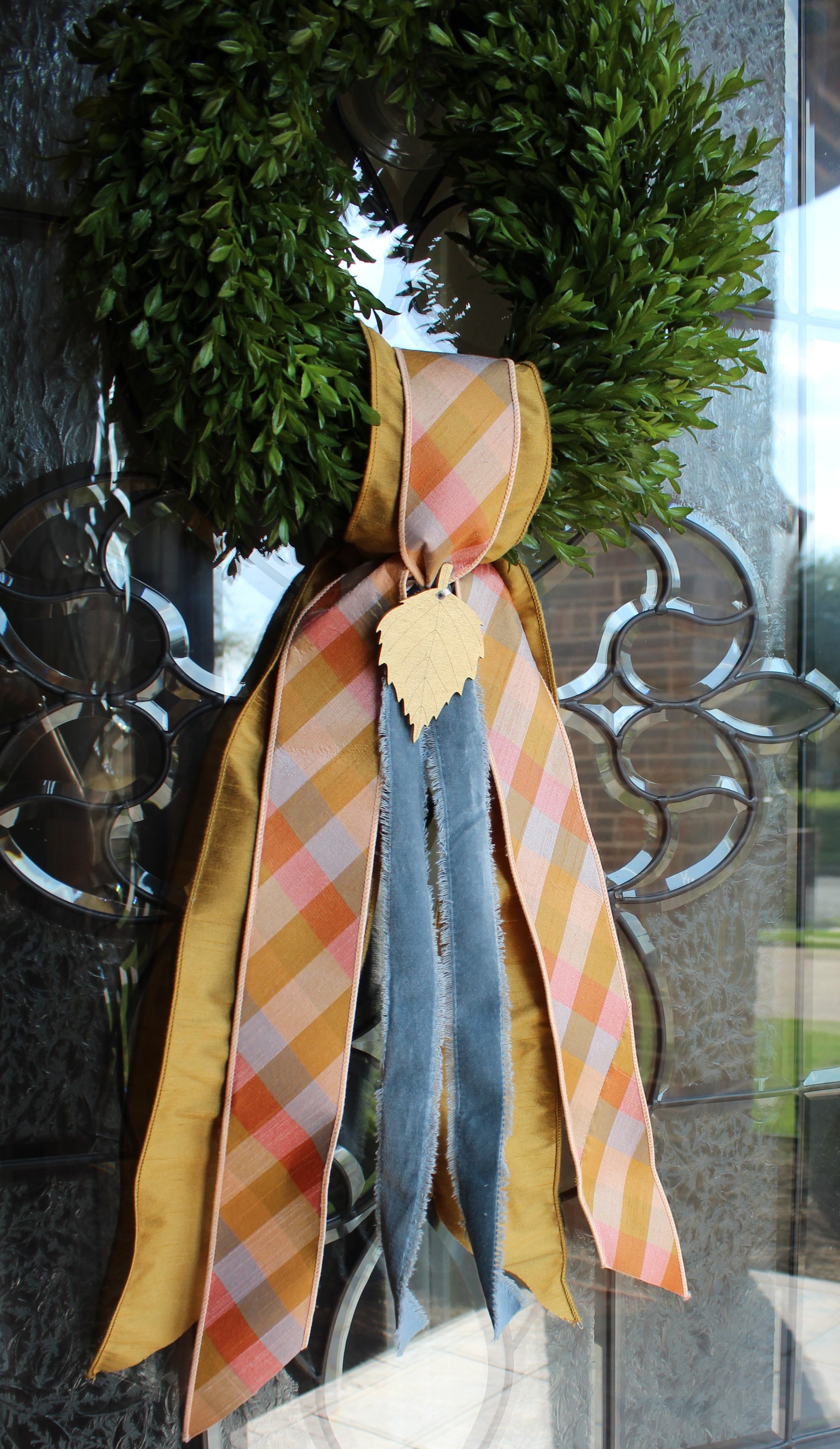 Fall decorative ribbons on a glass surface with a blurred background