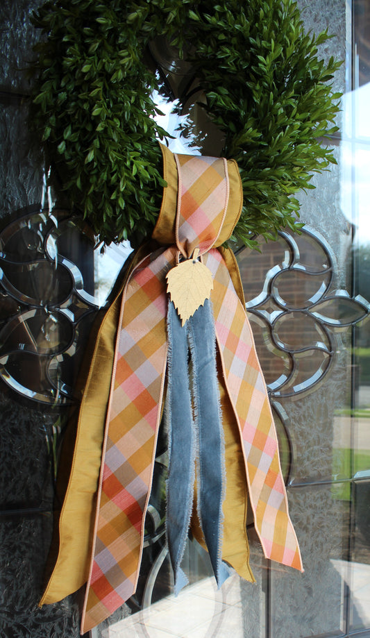 Fall decorative ribbons on a glass surface with a blurred background